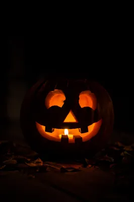 Glowing Jack-O-Lantern on Dark Porch