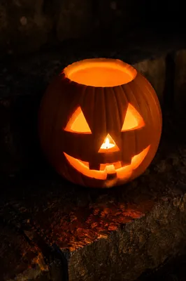 Glowing Jack O Lantern on Stone Steps