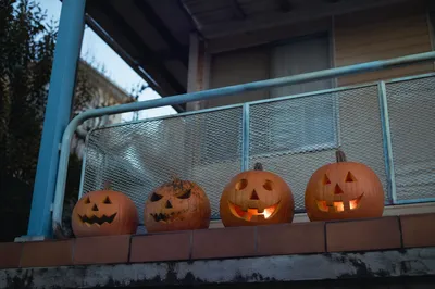 Carved Halloween Pumpkins on Dusk Porch