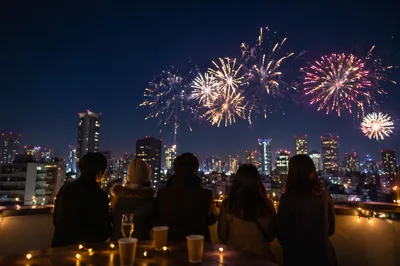 New Year Fireworks Over City Rooftop