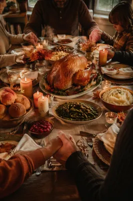 Thanksgiving Family Prayer Around Turkey Table