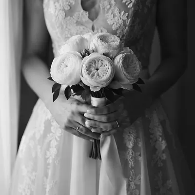 Bride Holding White Rose Wedding Bouquet