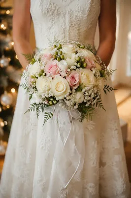 Elegant Bride Holding White Rose Bouquet