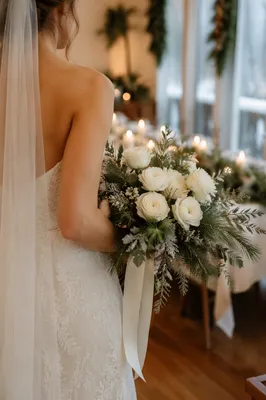 Winter Bride Holding White Floral Bouquet