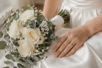 Bride Hands with White Wedding Bouquet