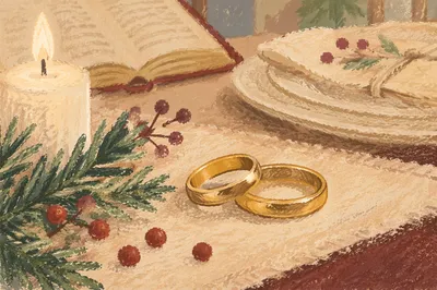 Elegant Gold Wedding Rings with Winter Greenery