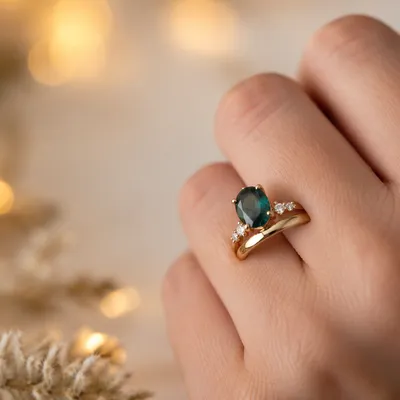 Elegant Gold Wedding Rings with Teal Gemstone