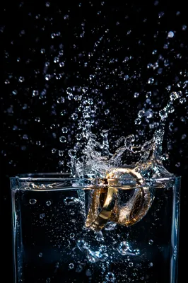 Gold Wedding Rings Splashing in Crystal Water