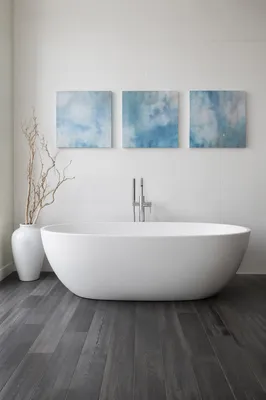 Minimalist White Bathroom with Blue Wall Art