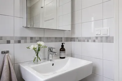 Modern White Tiled Bathroom With Sink