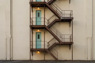 Urban Fire Escape Stairs on Stucco Facade