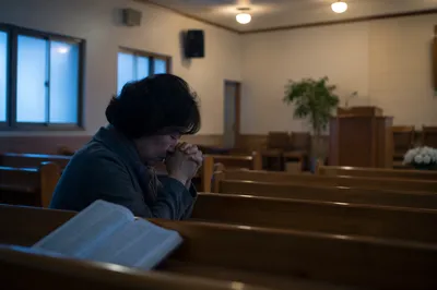 Quiet Dawn Prayer in Church Sanctuary