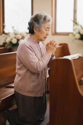 Elderly Korean Woman Praying in Church