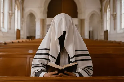Solitary Worshipper in Korean Church Pew