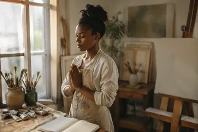 Young Painter Praying in Sunlit Studio