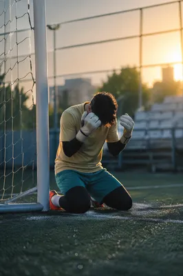Goalkeeper Kneeling in Sunrise Prayer