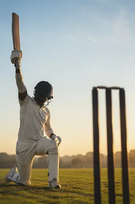Kneeling Athlete Celebrating at Sunrise Field