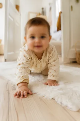 Playful Baby Crawling in Bright Minimal Home