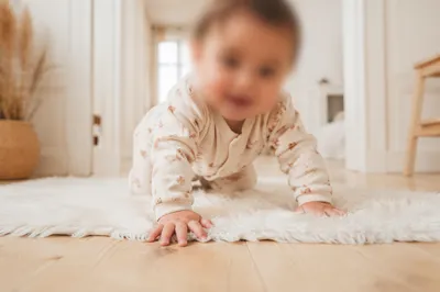Playful Baby Crawling in Bright Home