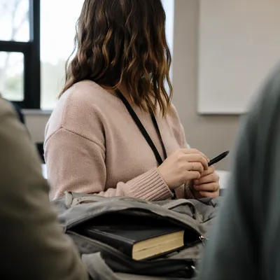 Bible in Backpack During Campus Seminar