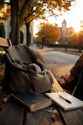 Bible in Backpack on Autumn Campus