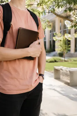 College Student Holding Bible on Campus