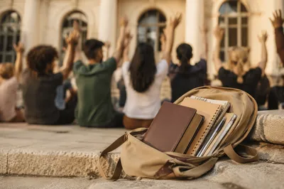 Bible in Backpack on Campus Steps