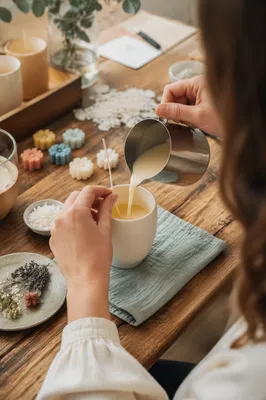Hands Pouring Wax in Candle Workshop