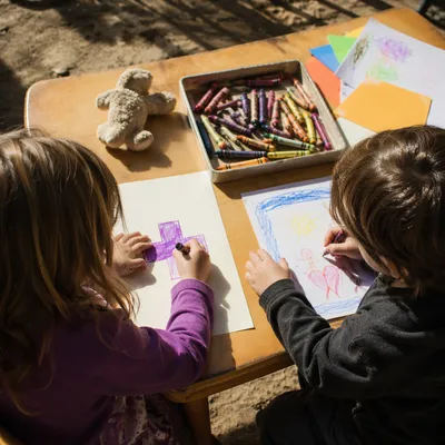 Children Drawing a Cross with Crayons
