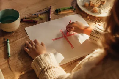 Child Drawing Crayon Cross at Home
