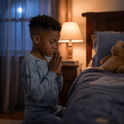 Young Child Praying Beside Bed at Night