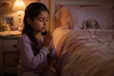 Young Girl Praying Beside Bed