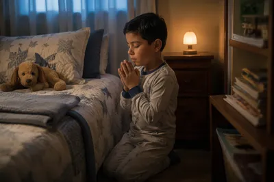 Young Boy Praying Beside Bed