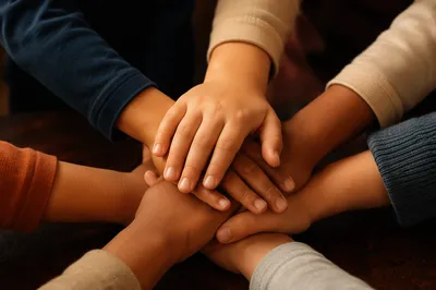Children Stacking Hands in Teamwork