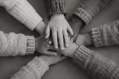 Children’s Hands Stacked in Teamwork