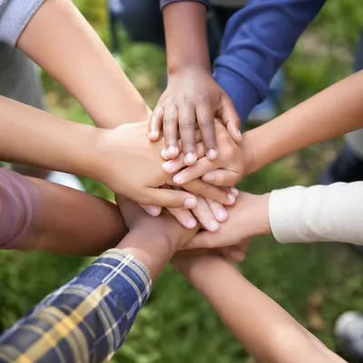Children Hands Stacked in Cheerful Teamwork