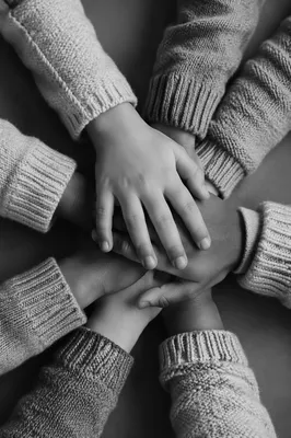 Kids Hands Stacked in Teamwork