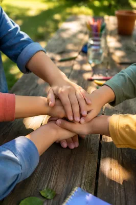 Children Hands Stacked in Garden Teamwork
