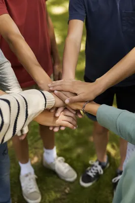 Children Stacking Hands in Outdoor Teamwork