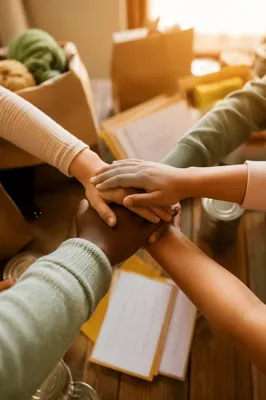 Children Stacking Hands for Teamwork