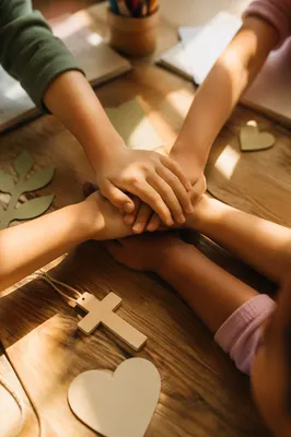 Children Stacking Hands in Church Fellowship