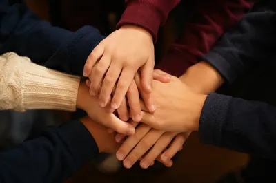 Children Hands Stacked in Teamwork Unity