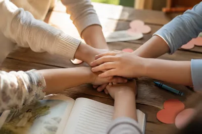 Children Hands Stacked in Sunday Teamwork