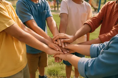 Children Hands Stacked in Outdoor Circle