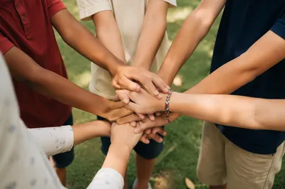 Children Stacking Hands in Outdoor Teamwork