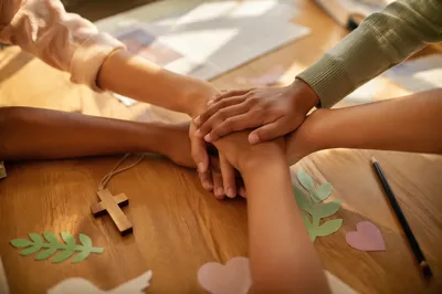 Children’s Hands Stacked in Church Teamwork