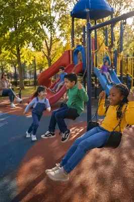 Children Playing on Swings and Slides