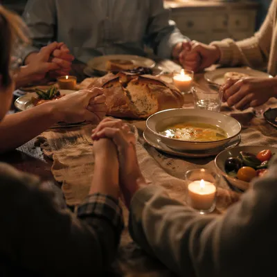 Christian Family Dinner Prayer Around Wooden Table