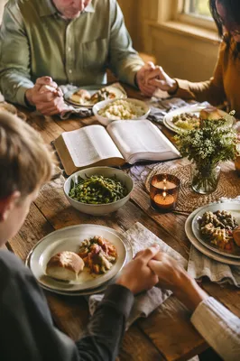 Christian Family Dinner Prayer Around Wooden Table