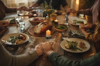 Christian Family Dinner Prayer at Rustic Table